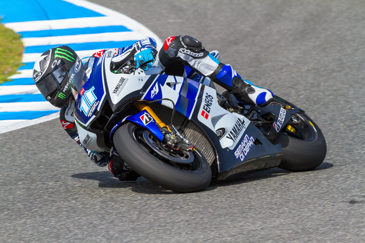 Ben Spies aboard a Yamaha super bike on a MotoGP track.