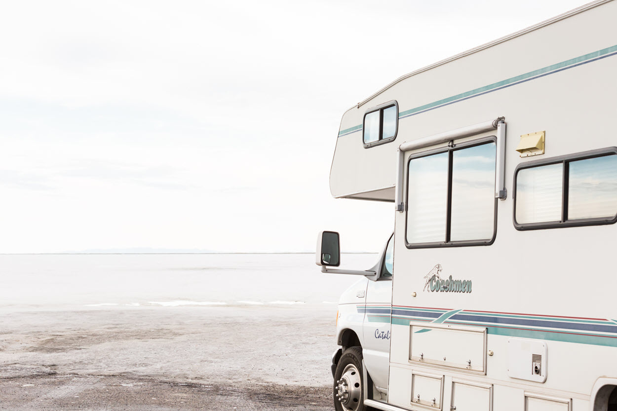 A Coachmen motorhome traveling on the Bonneville Salt Flats